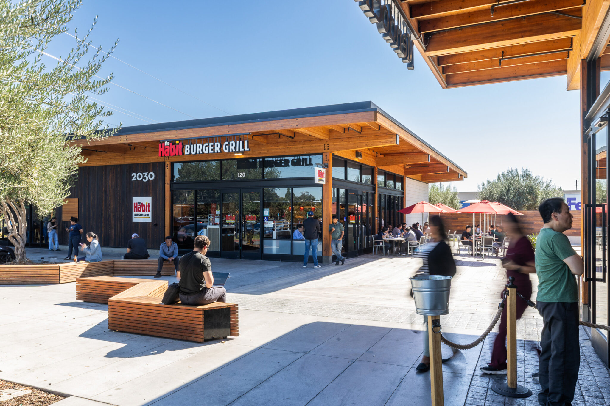 Exterior shot of people queuing at Mission Park Marketplace